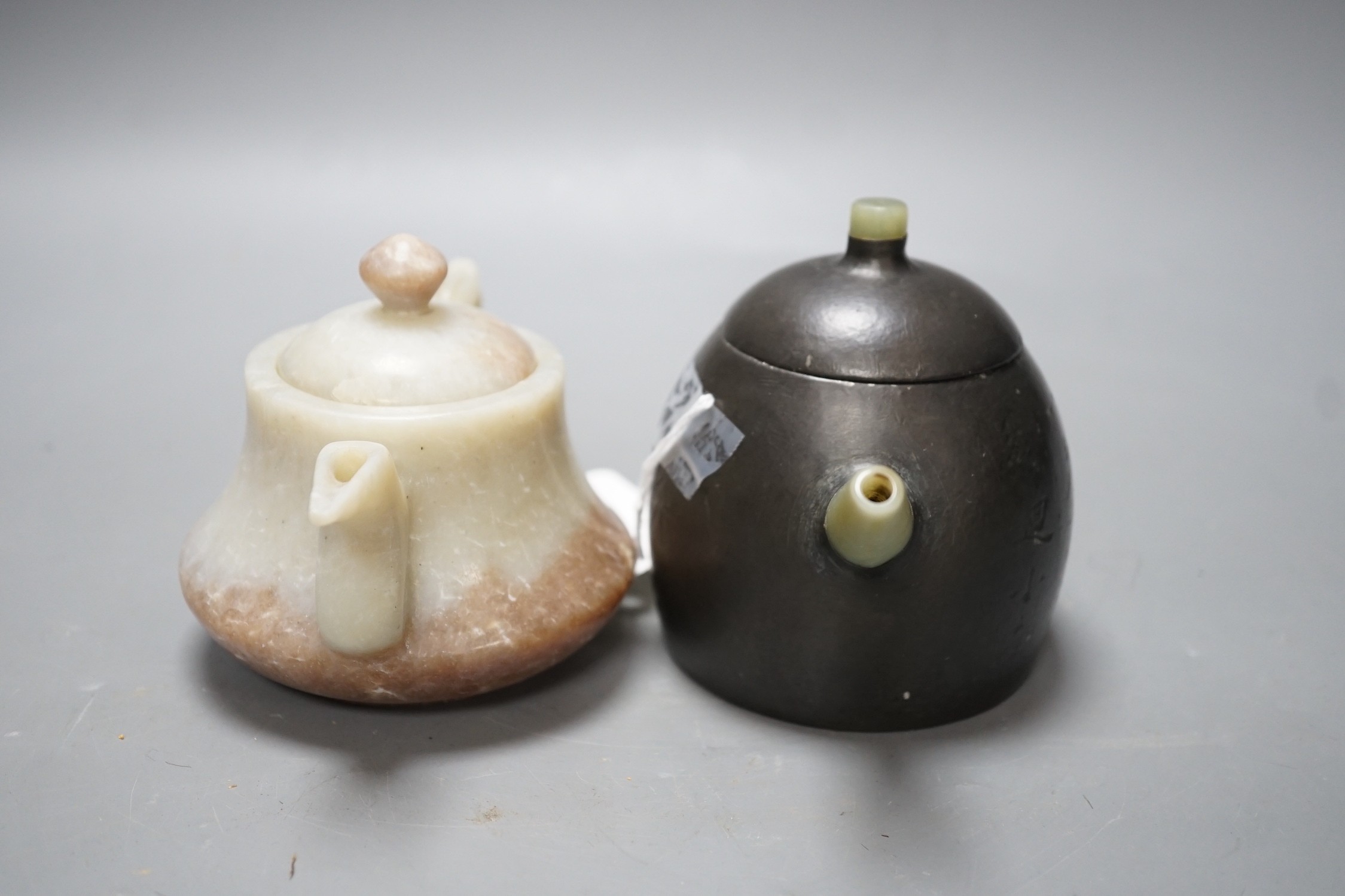 A Chinese jade wine pot and a Yixing pewter and bowenite jade mounted tea pot (2)